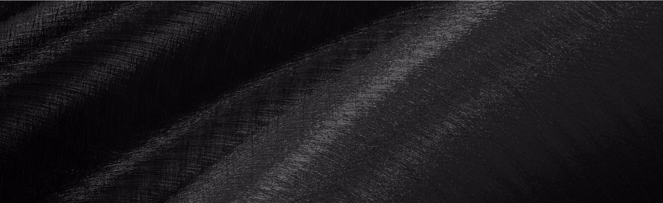 Abstract black textured background with brush strokes.