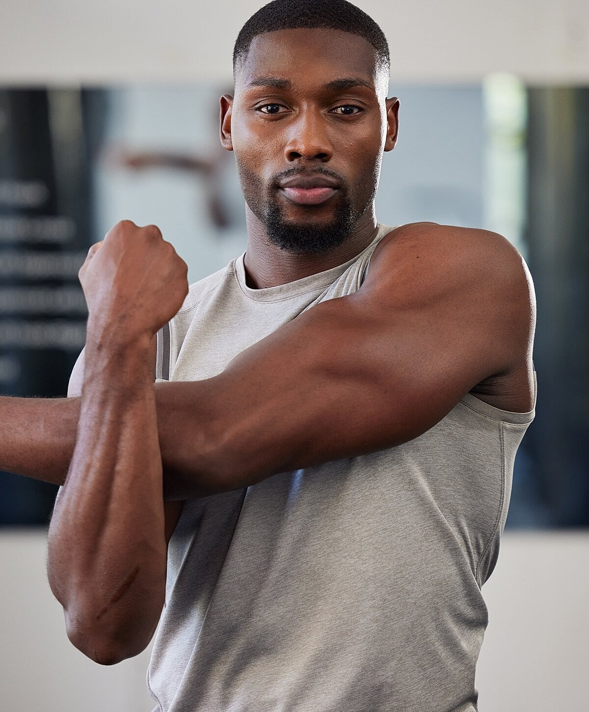 Woman in stylish bikini posing against white background.