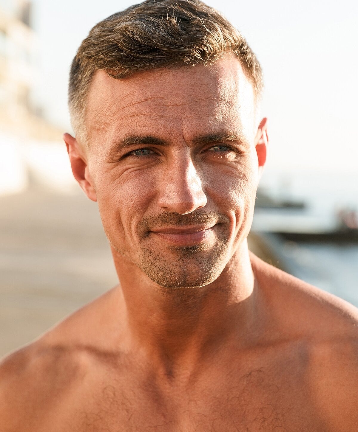 Surgeon in scrubs with focused expression.