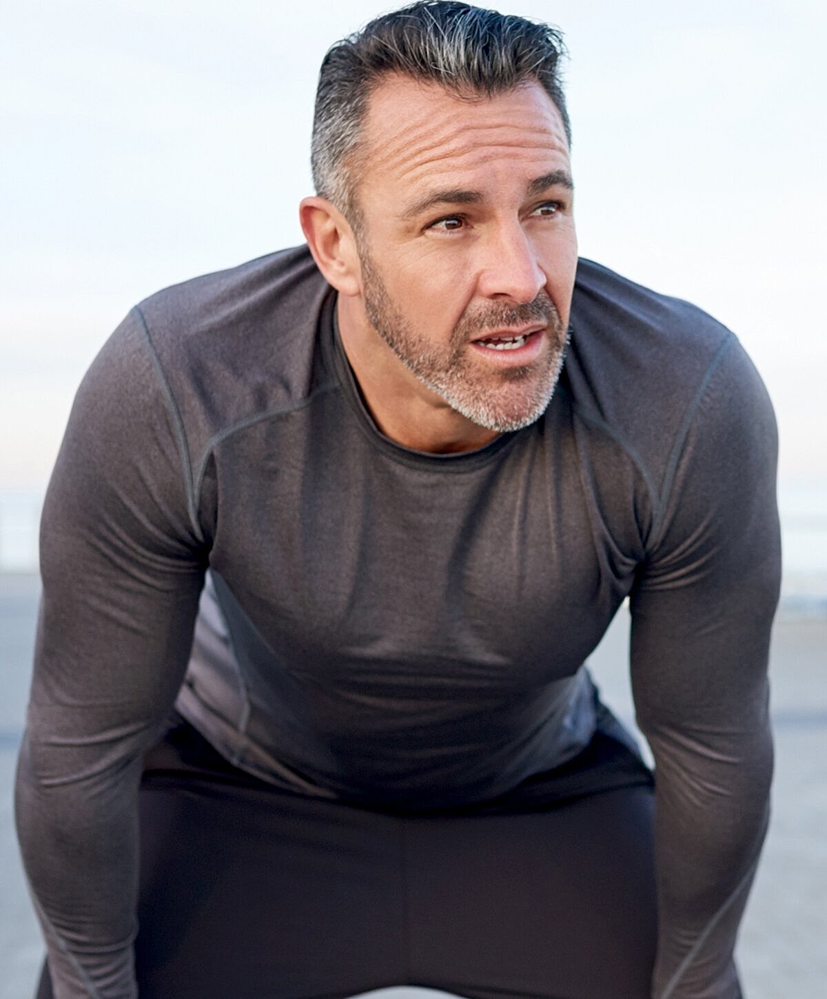 Man in athletic wear, focusing on fitness.