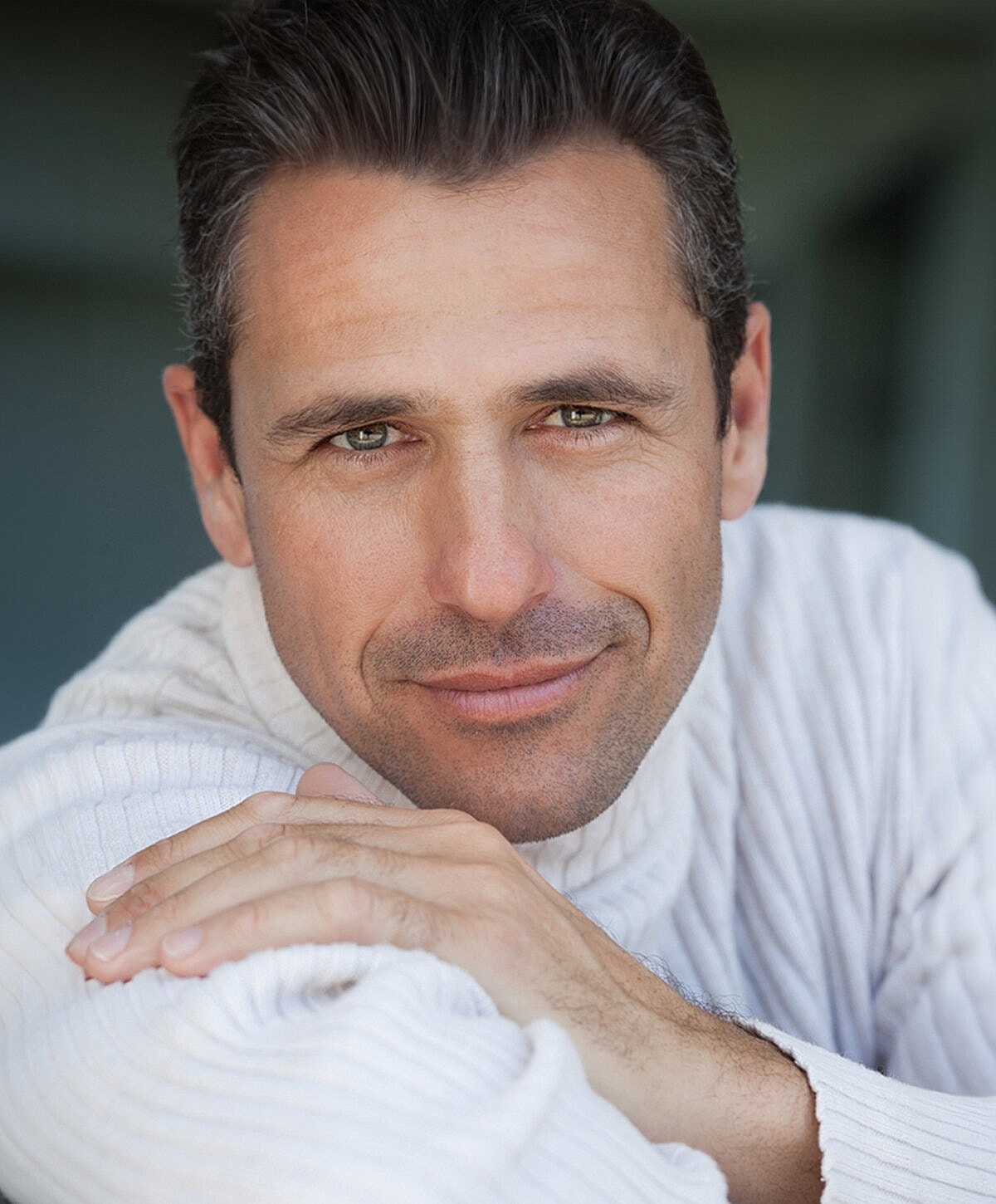 Model in stylish black lingerie, hair styled.