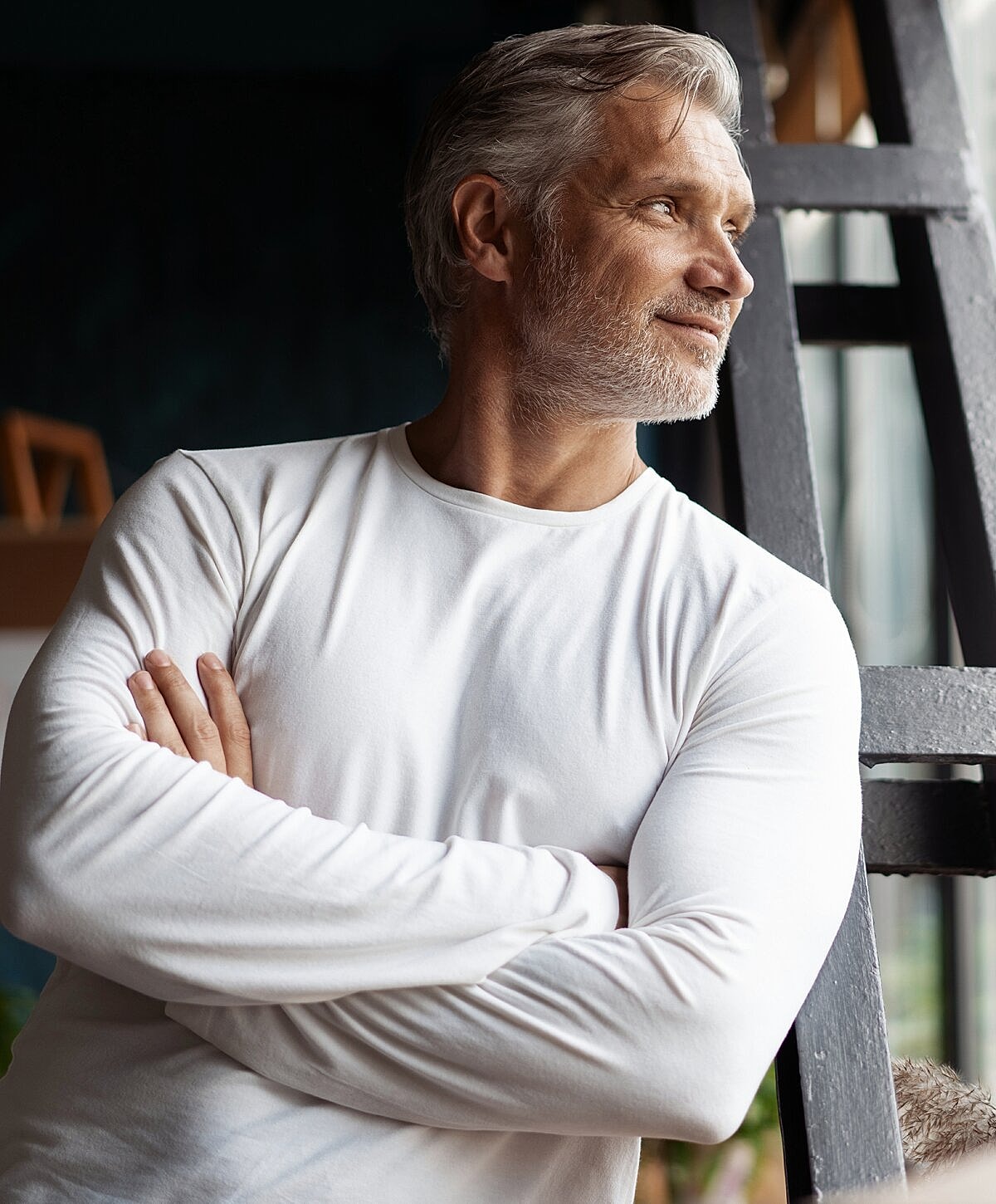 Woman reading document on a blue couch.