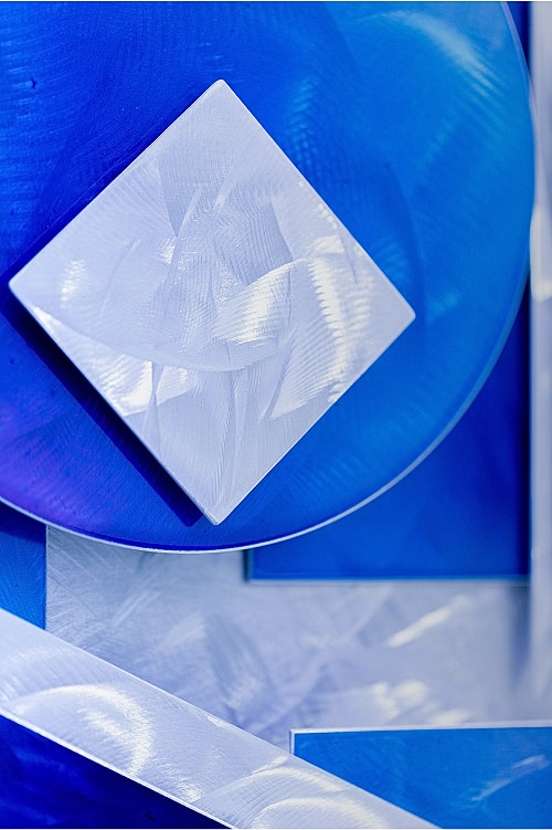 Abstract blue shapes with geometric designs.