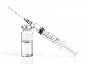 Syringe and vial with liquid medicine.