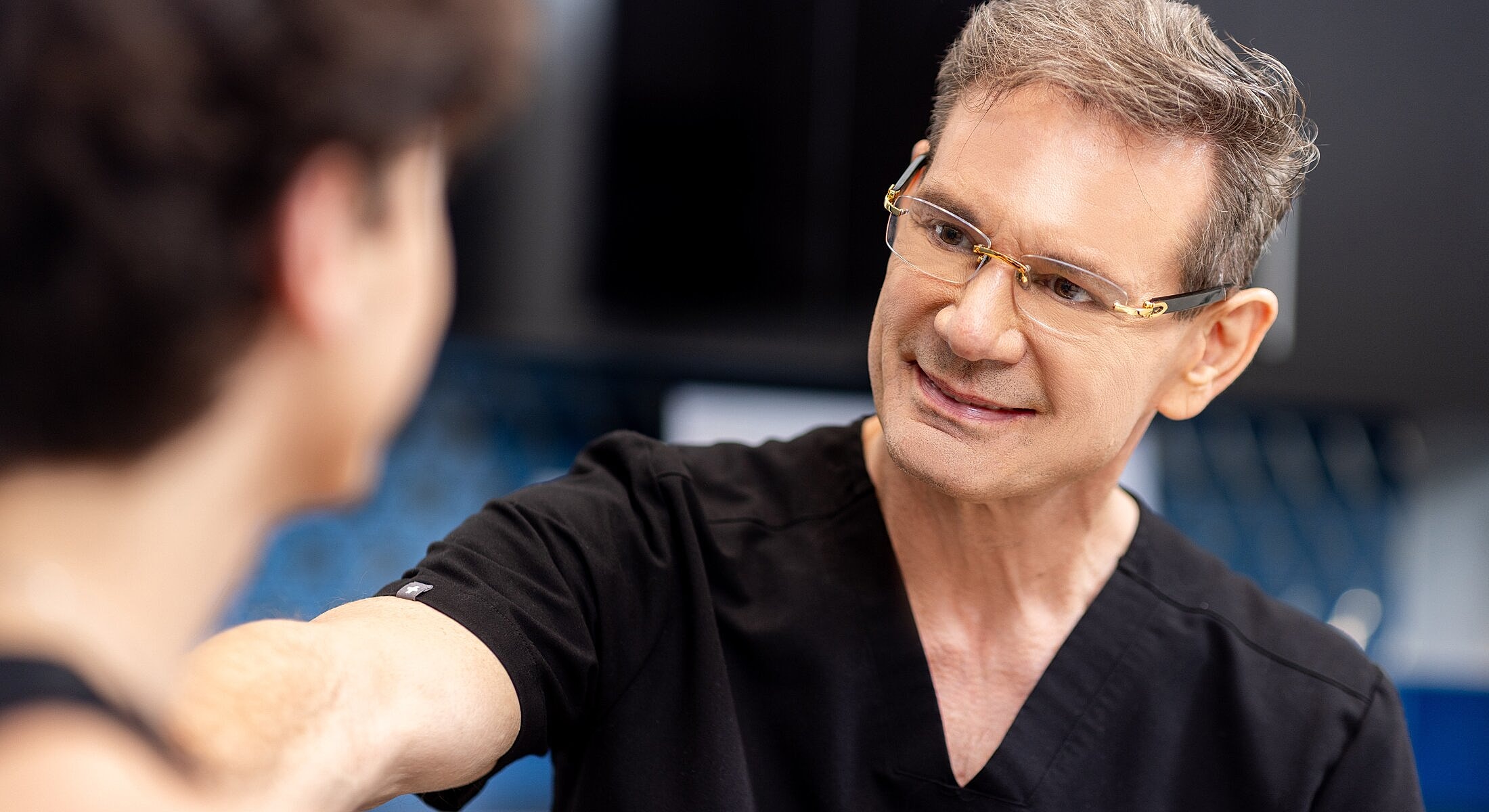 Doctor consulting with a patient in clinic.