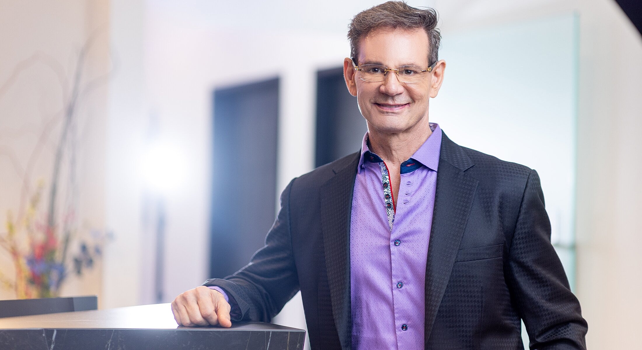 Medical team posing together in modern office.