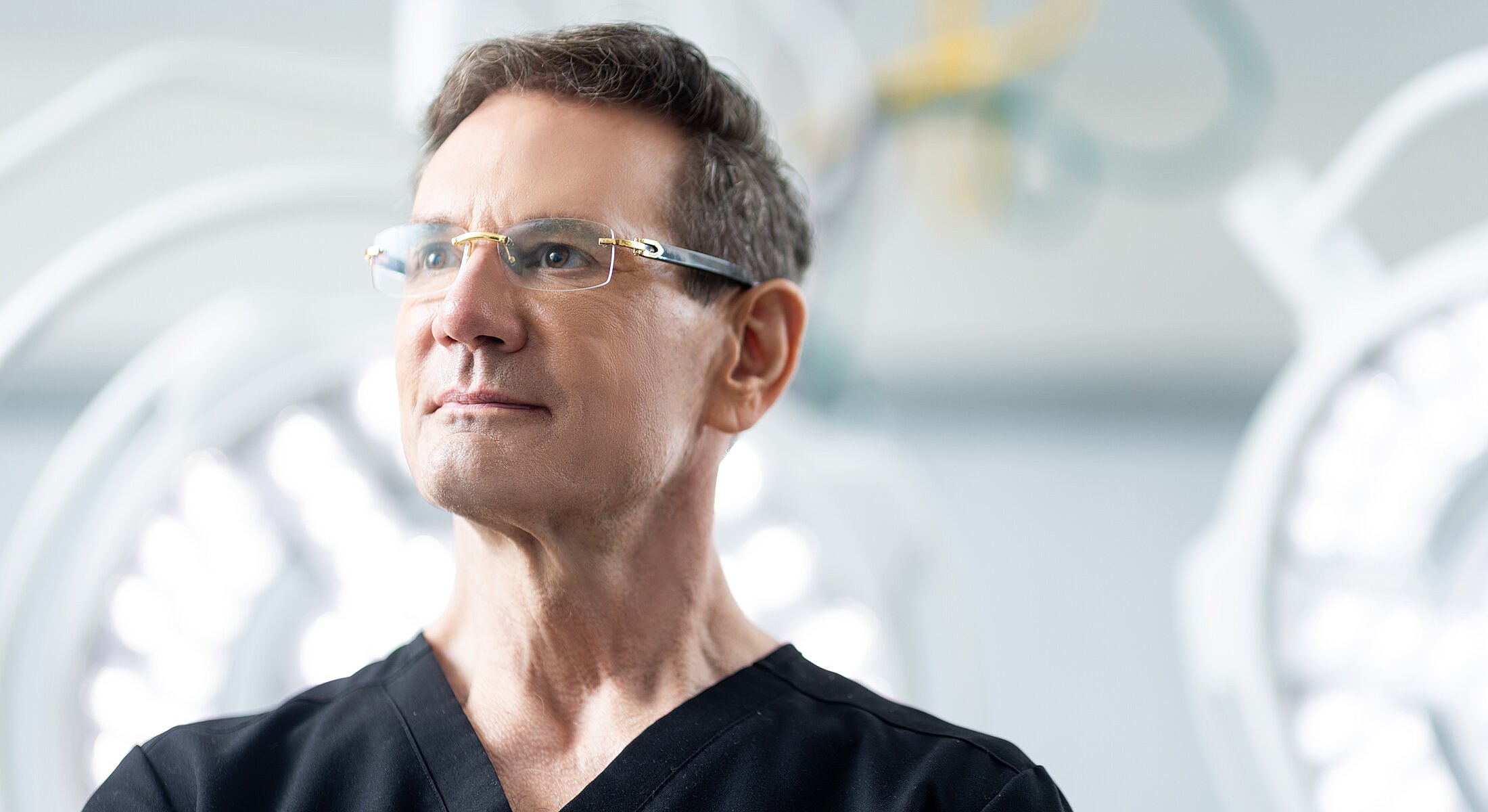 Surgeon in operating room, focused and confident.