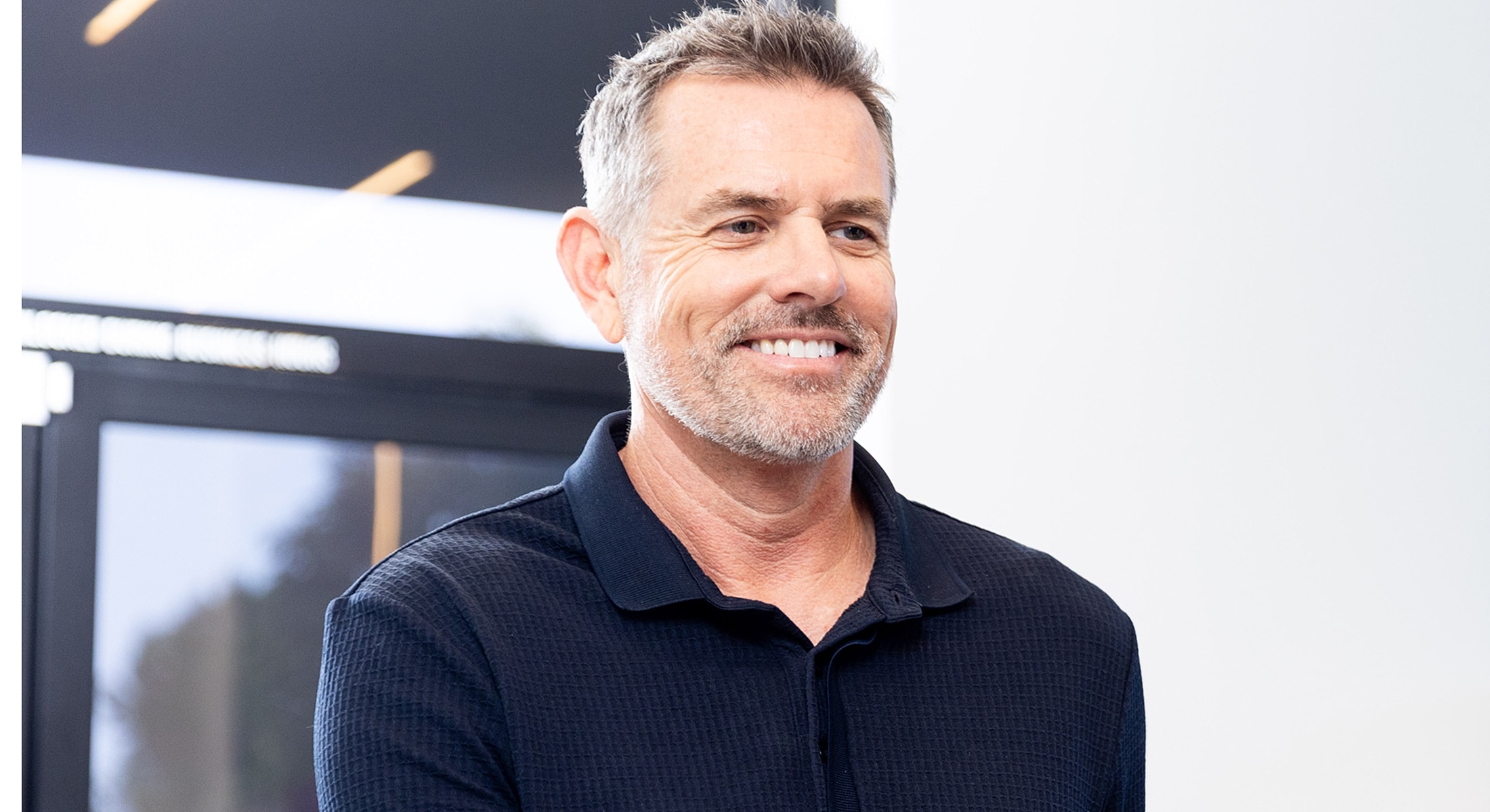 Smiling man with towel, relaxed and happy.