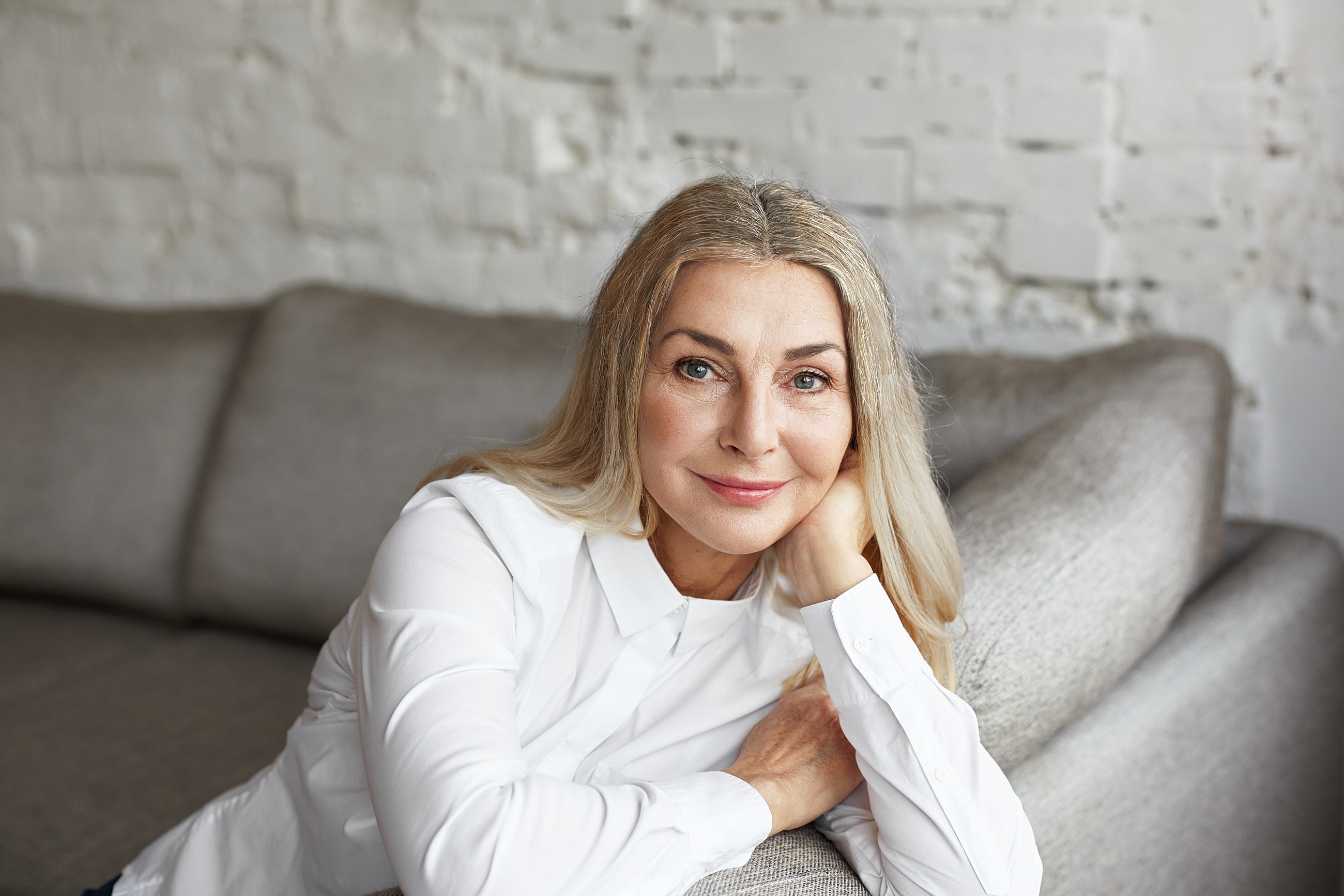 Woman with flowing hair against a light background.